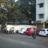 Footpath with car and talking people, Mumbai