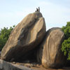 People sitting on the rocks at Mahabalipuram