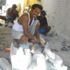A statue maker makes sculpture at Mamallapuram sculptues shop
