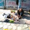 A man repairing footwear in Indore