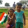 Sister with her brother holding the Indian flag