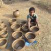 A Boy with New Clay Pots at Khauapli, Bargarh