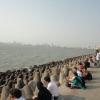 People relaxing near sea shore in Mumbai
