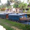 Small boats at the road side river in Alappuzha