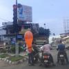 A Man Selling Balloon to People Caught in Traffic Signal, Kerala