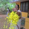 An old lady with Vishu flowers
