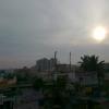 Sun and skyline over Madivala settelment in Bangalore