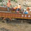 People working on Truck Collecting Materials, Bankura