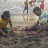 Making a sandhouse in the beach