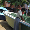 A man service the boat at Muttukadu boat house