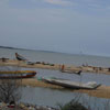 Fishing boats and Catamarans on the seashore at Kovalam