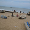 A fisherman preparing a fishing net at Kovalam beach in Chennai...