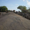 People sitting on the mountain at Mahabalipuram