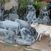Sculpture of Cow with a real Calf in the back at Mahabalipuram...!