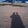 Couples - real and shadow on the beach
