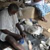 Man repairs chappals on the M. G. R. Nagar street side - Chennai...
