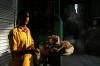 Chandni Chowk - A street vendor prepares food