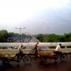 Rickshaw Pullers on an Over-Bridge during Drizzling in delhi