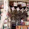 The Craftswoman Setting handbags in Her Shop, Dilli Hat, New Delhi