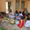 Brahmin doing Saraswatipuja for a family