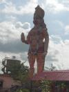 Lord Anjaneya standing in front of his temple