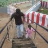 Baby walking up the steps without any help at the Karuupasamy Temple Rock