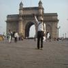 Man trying to measure the height of gateway of India