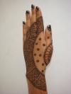 Mehendi design at the back side of the hand