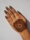 simple and great look of mehendi design and the simple nail polish