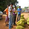 People eating jack fruit from the street vendor